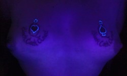 whiteslut4bbc:  My tit tats r blacklight responsive too! I wanna get a pic under blacklight after they have been cummed on!  thank you so much ! how the tatoos are blacklight responsive ? I am very interested to be tatooted like you, on my berest, upper