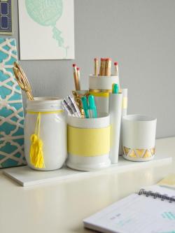 scissorsandthread:  Desk Caddy | HGTV There are so many great products out there for us DIYers, and one of my favourites is glass spray paint. It can make a group of mismatched containers like the ones above look like a purpose built set. The added decora