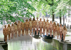 Naked volunteers stand on an invisible bridge constructed by for photographer Spencer Tunick for a photoshoot in Amsterdam June 3  2007