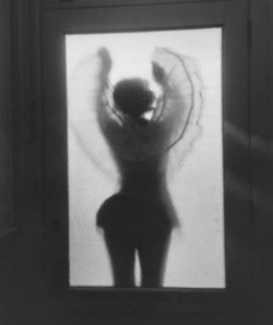 1950sunlimited:  Girl in crinoline skirt through frosted glass 1950s 