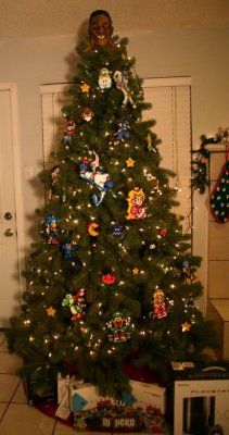 dorkly:  Retro Videogame Ornaments The 16-Bits of Christmas.  HOLY FUCKING SHIT! The Mike Tyson&rsquo;s Punch Out tree topper is all I could concentrate on.