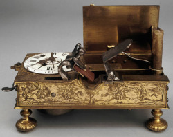 peashooter85:  Mechanical alarm clock with flintlock candle lighting mechanism.  The flashpan of the mechanism was filled with gunpowder.  When the alarm sounded the cock would strike the frizzen, igniting the gunpowder which then would light the candle.