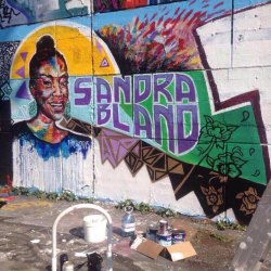 icecream-eaterrr:  ebonymag:  Artists in Ottawa, Ontario, Canada turned the Ottawa Tech Wall into a tribute to #SandraBland.  Some one defaced this piece of work and put facial hair on Sandra and put all lives matter over her name… If all lives mattered…