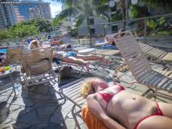proudofherbush:  just tanning at a public pool in her microbikini - with a full bush!