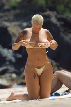 sexciiwomeninlingerie:  SECOND HELPING…Here is Amber Rose wearing a g-string bikini and putting her big boobs on display after taking off her bikini top on the beach in Maui…and as you would expect there is a lot of big boobs and big ass in these