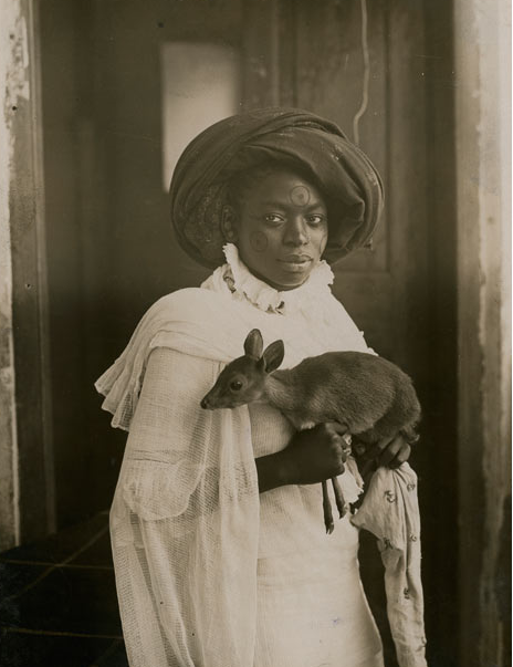 nobrashfestivity:Unknown YOUNG KENYAN WOMAN HOLDING A DIK-DIK, MOMBASA, 1909  