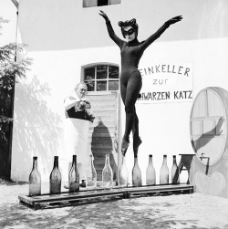 Seventeen-year-old Bianca Passarge of Hamburg dresses up as a cat and dances on wine bottles in June 1958. Her performance was based on a dream. She practiced for eight hours a day to do this. (x)