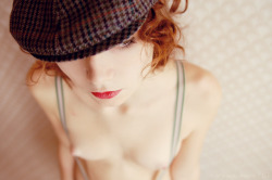 fireredgirls:  Cute little breasts on this sexy redhead with suspenders.