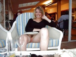 carelessnaked:In a short skirt inside a restaurant and showing her pussy