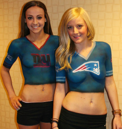 sportsbodypaint:  Fan girls in body painted Manning and Brady, New York Giants and New England Patriots jerseys!