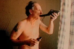 disregardinghenry:Werner Herzog drinks cough syrup from a shoe. Harmony Korine’s Julien Donkey-Boy. 1999.