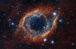 sci-universe:  NGC 7293, better known as the Helix nebula, is the nearest example of a planetary nebula, which is the eventual fate of a star, like our own Sun, as it approaches the end of its life. As it runs out of fuel, the star expels its outer envelo