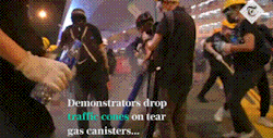 goldenxtongued: kropotkindersurprise: June 2019 - Protesters in Hong Kong use traffic cones to contain the gas from tear gas grenades, then drown them in water. [video] reblogging for uh. pure scientific purposes 