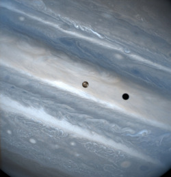 humanoidhistory:  Io in transit across the face of Jupiter, observed by the Hubble Space Telescope in 1999. 