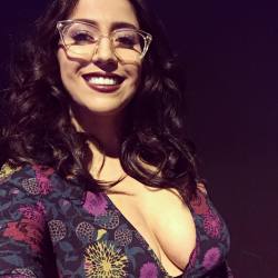 April O'Neil shows off magnificent tits and supercute smile.