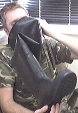 With the trigger in place, he could not help himself. He had to breathe deeply of the rank, rubber wader. With each breath, he became more and more of a rubber boots slave. Eager to serve, desperate to smell more.