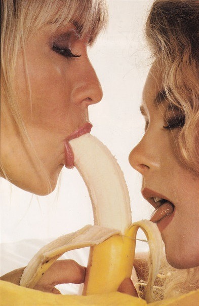 Nude girl eating banana