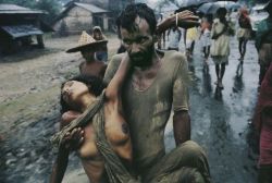 exclusive-femme:  satansseed:  historicaltimes:  A refugee carrying his cholera-stricken wife away from the fighting during the Bangladesh war in 1971. Photo by Mark Edwards Read More  Omg…this picture. It’s sad but it’s beautiful.   Wow.