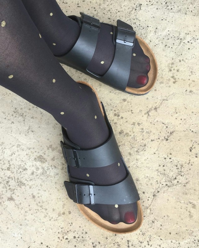 Polka dotted pantyhose with Birkenstock.
