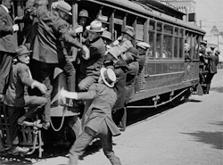  Harold Lloyd tries to board the streetcar in Safety Last! (1923) 