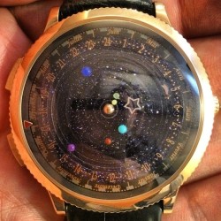 inkylitso:  The Midnight Planétarium watch not only tells time, but follows the orbit of our solar system’s planets. 