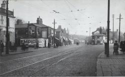 manchestergalore:  Junction of Stockport Road and Slade Lane in Longsight in 1923  The small building at the meeting of the two roads (with the Bovril sign) is the Toll House - Sally Dervan  Same spot on google maps