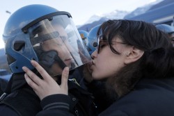 untrustyou:  A demonstrator kissed a police officer during a protest in Susa, Italy, against a high-speed train line between Lyon, France, and Turin, Italy.  Marco Bertorello 