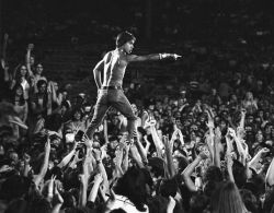 theunderestimator:  Iggy Pop inventing crowd surfing in the iconic Tom Copi photograph from the 1970 Stooges gig at the Cincinnati Rock Festival. (via) 