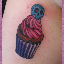 sniickersnee:  I got cupcake tattoos under both butt cheeks today! I’ll post a pic tomarrow of both of them :) #cupcaketattoo #freshtattoo #freshink #cupcakes #skulltattoo #sweettooth