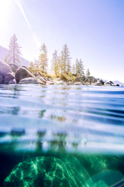 ne0nicecream:  this is haphazardly swimming around at sand harbor in lake tahoe - i forgot goggles so to see underwater I had to gaze through the eyepiece of the housing - a very vulnerable and disconcerting feeling. all the boulders beneath (which are