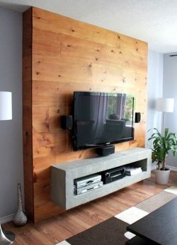 sweetestesthome:  I like the idea of framing the TV with wood planks. I think I might just put some planks directly on the wall and center the TV on it instead of doing floor to ceiling.