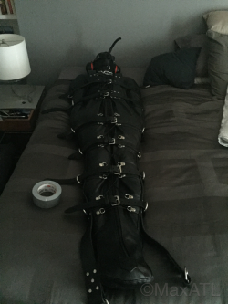 maxatl:  MASTER was resting and did not want to be disturbed, so he put his slave away for a couple of hours. He kept pumping the inflatable gag, however, so it wasn’t a peaceful rest…. Btw I think this pics are awesome. The leather is just so hot