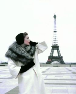 wehadfacesthen:  Suzy Parker at the Eiffel Tower wearing a winter ensemble by Givenchy in a 1954 photo by Georges Dambier for ELLE magazine 
