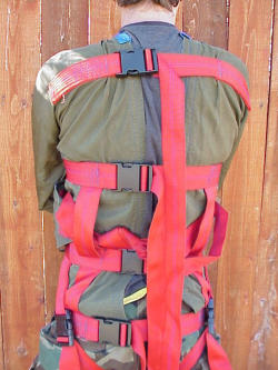 louis-sj: I made this nylon straitjacket some years ago. The body material is the same material that was used for a short while in duffel bags. Quite strong. The red strapping is all 2 inch tubular strapping. A few notes about it: 1)The straps are all