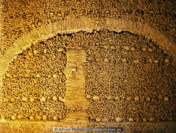 Capela dos Ossos (English: Chapel of Bones) Located in the walled medieval city of Evora, Portugal, the Capela dos Ossos is a 16th century Franciscan chapel lined with skulls and bones that stretch over the interior groin vaulting and all over the walls.