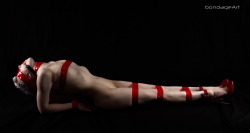 manicdelightofficial:  I felt like a candy cane. :) The yoga pose is fish pose by the way. Credits to BondageArt. 