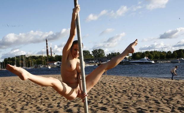 Dancing naked pole dancer
