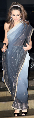 carelessnaked:  Elizabeth Hurley wearing a transparent saree without any blouse or bra 
