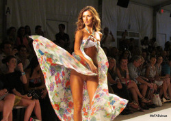 bottomleshonesty:  http://bottomleshonesty.tumblr.com  Bottomless bathing suit with oversized floral wrap. Will it catch on?  