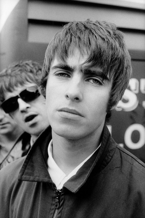 mellygallagher:  Liam Gallagher with Noel Gallagher behind, 1994.Pictures by Michel Linssen  