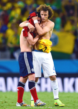 lordoftheswag:  thomasbsangster-blog: David Luiz of Brazil consoles James Rodriguez of Colombia after Brazil’s 2-1 win during the 2014 FIFA World Cup Brazil Quarter Final match between Brazil and Colombia on July 4, 2014    he played so good this world