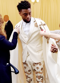 wesleygasm: Chadwick Boseman getting ready to attend the Heavenly Bodies: Fashion &amp; The Catholic Imagination Costume Institute Gala at The Metropolitan Museum of Art on May 7, 2018 in New York City.