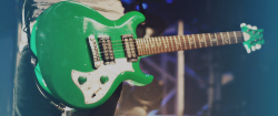 iyeols:  Alex Gaskarth’s guitars: lime green Custom PRS Mira 
