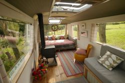 busmagicbus:  The Majestic Bus has a beautiful wooden floor, painted pine boarding and a well thought-out dining/kitchen area with hand-built units, oak worktops, a gas cooker and a fridge. At the back is a cosy double bed and a wood-burning stove placed