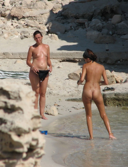 People having sex on a nude beach