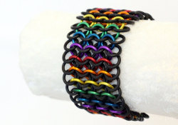 links-to-the-past:  Rainbow is one of our most popular designs here at Links to the Past. The vibrant metal chainmail rings set against stretchy black rubber make the colors really pop. The best part? You can wear it with anything! We currently offer