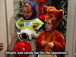   #i dON’T GET IT the one handing out the candy is Jonathan Taylor Thomas, the voice of Simba in The Lion King. His dad in the show is Tim Allen, the voice of Buzz Lightyear.  