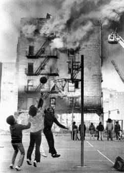 shihlun:  A fire burns in the Bronx while local kids continue to play ball.   Every day shit, nothing new!!!