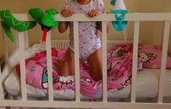 littleminxy3:  So happy and comfy in this cot!! The mobile was so relaxing :) Daddy slept in it with me too!
