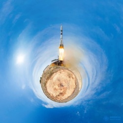 Little Planet Soyuz   Image Credit &amp; Copyright: Andrew Bodrov  Explanation: Engines blazing, a large rocket bids farewell to this little planet. Of course, the little planet is really planet Earth and the large rocket is a Soyuz-FG rocket. Launched